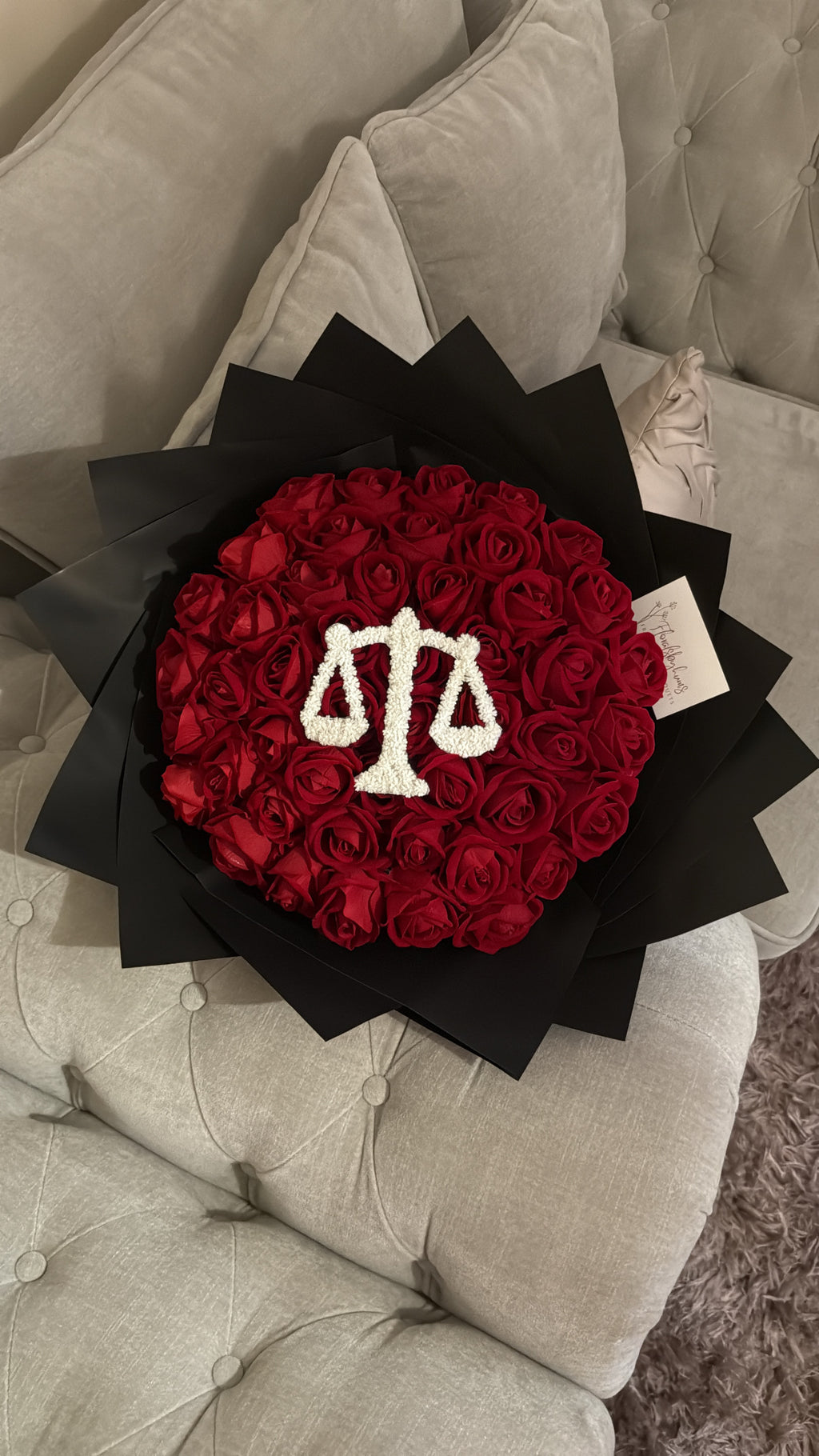 Red faux flower grad law bouquet