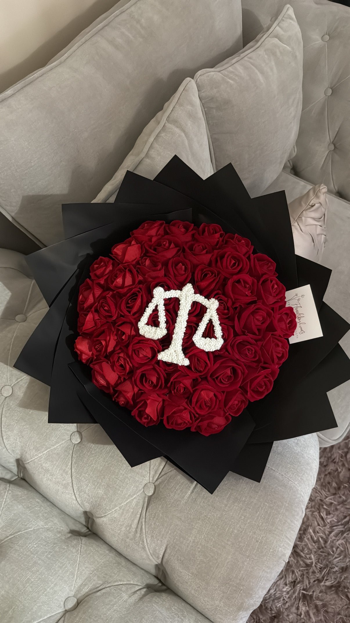 Red faux flower grad law bouquet