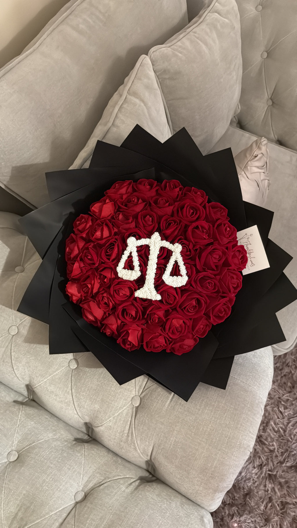 Red faux flower grad law bouquet