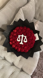 Red faux flower grad law bouquet