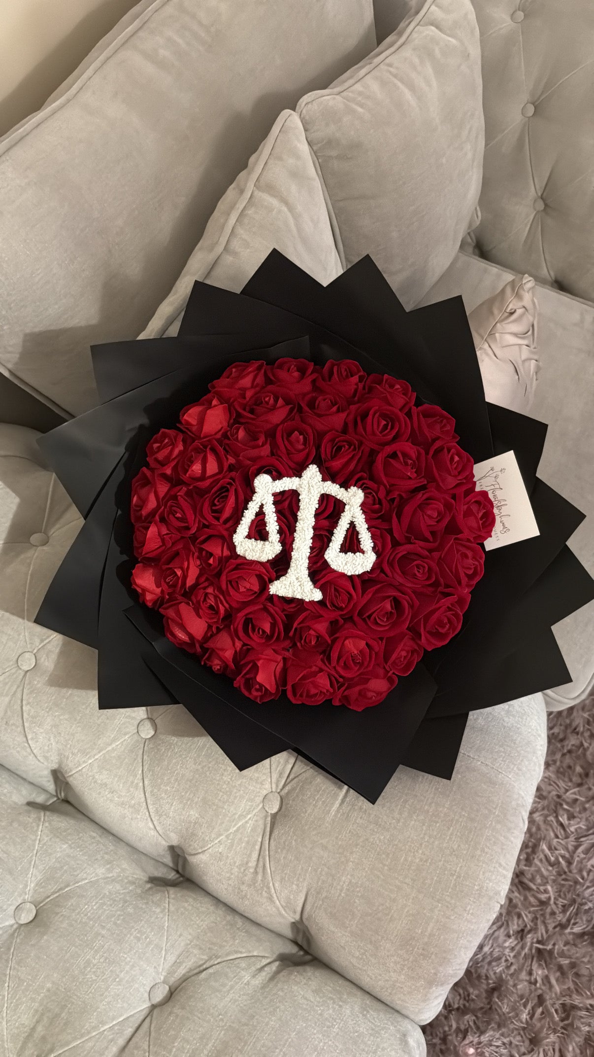 Red faux flower grad law bouquet