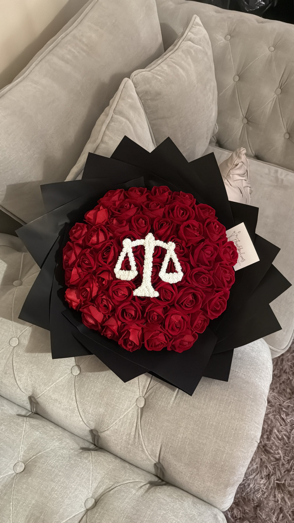 Red faux flower grad law bouquet