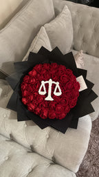 Red faux flower grad law bouquet