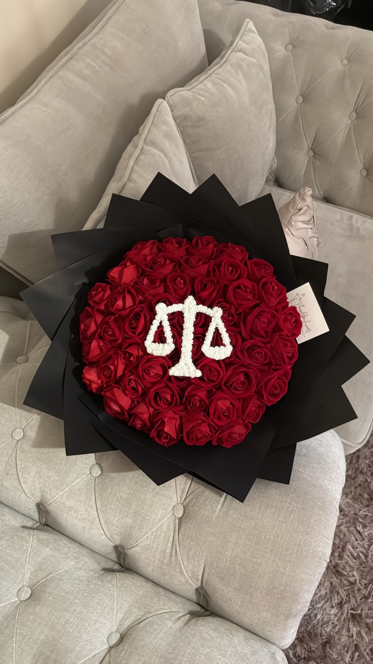 Red faux flower grad law bouquet